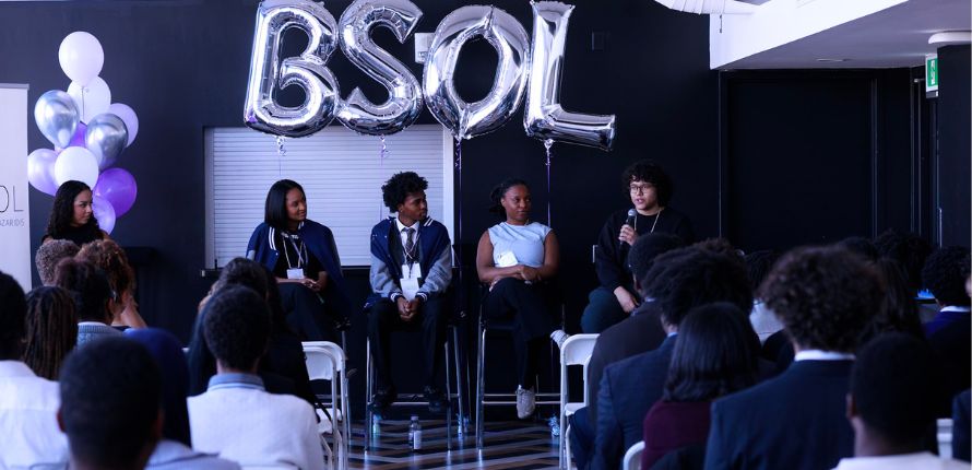 A panel of speakers at a conference.